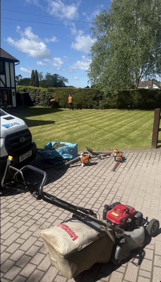 Lawnmower and hedge trimming kit ready for a grounds maintenance visit