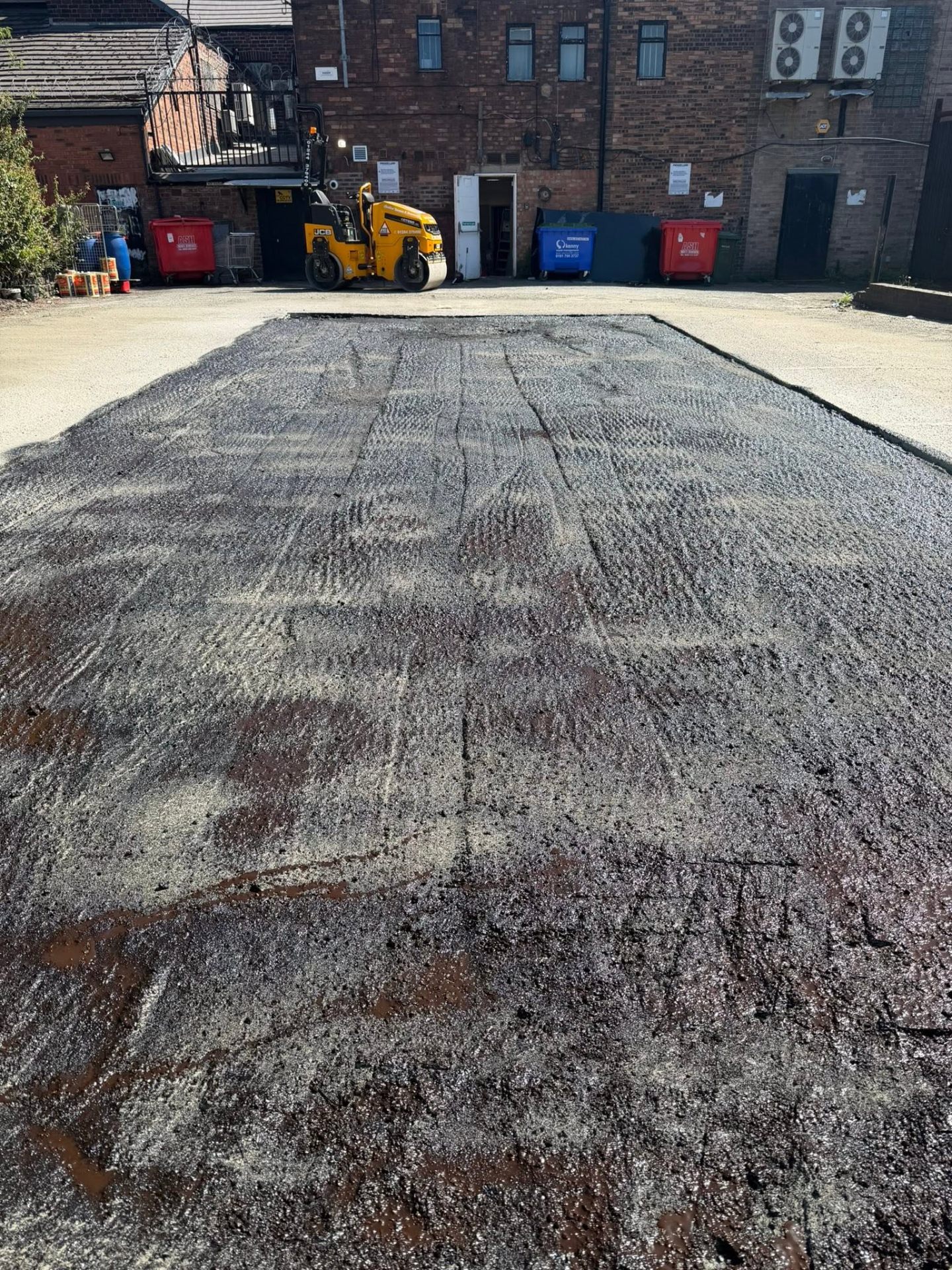 Freshly laid bitumen surface during external grounds works