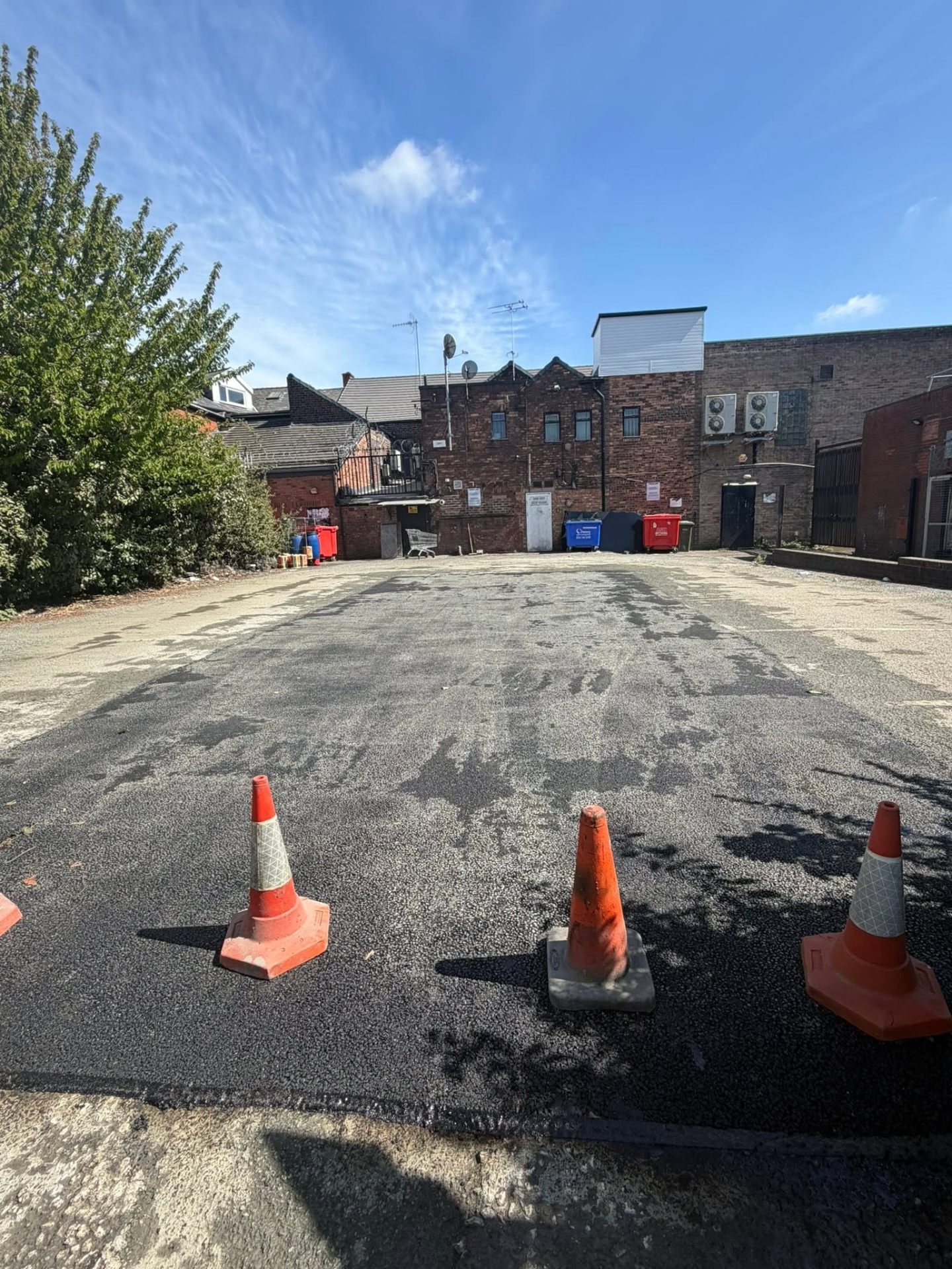 Freshly jet-washed car park surface after a commercial clean